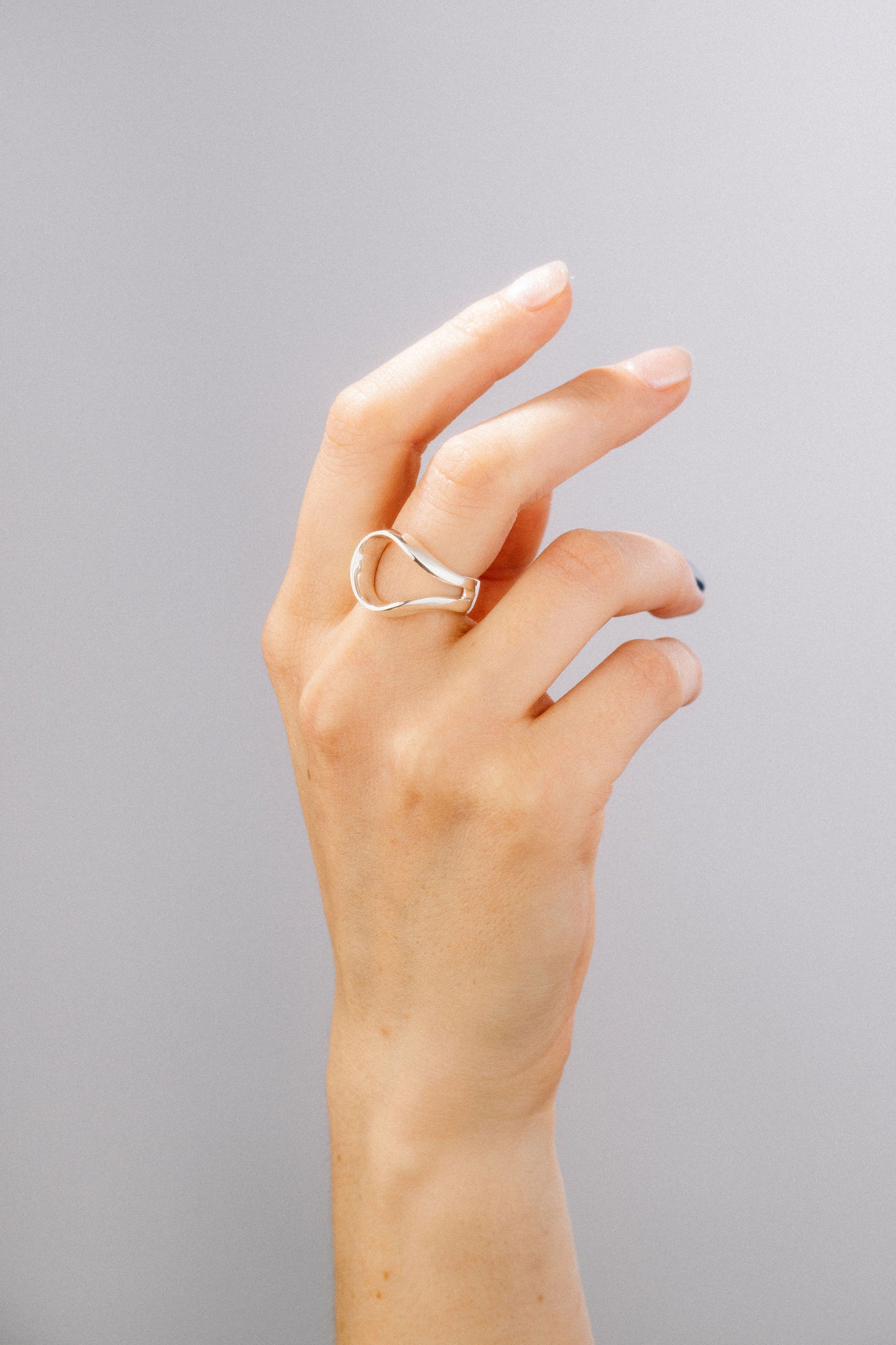 Loop Ring in 925 silver, slightly twisted open oval signet ring, handmade by Minou Lejeune