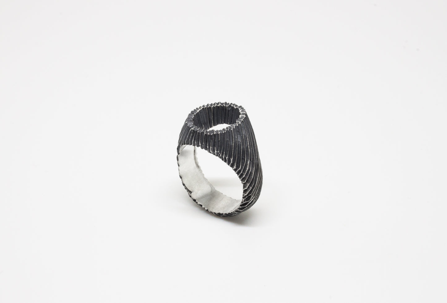 Carved open signet ring in oxidated 925 silver, hand-carved unique piece by Minou Lejeune