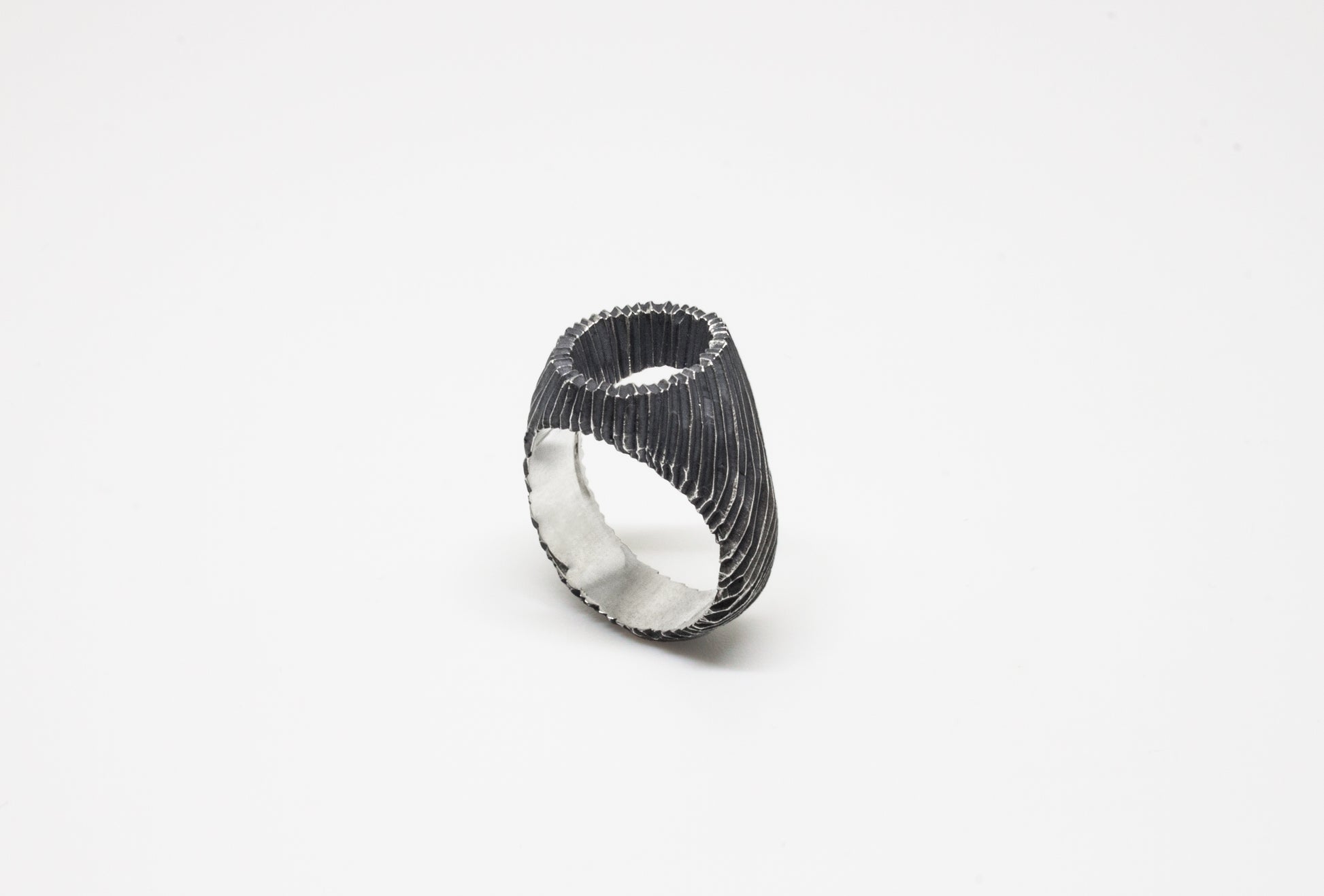 Carved open signet ring in oxidated 925 silver, hand-carved unique piece by Minou Lejeune