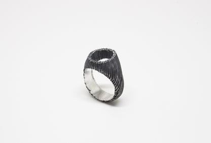 Carved open signet ring in oxidated 925 silver, hand-carved unique piece by Minou Lejeune