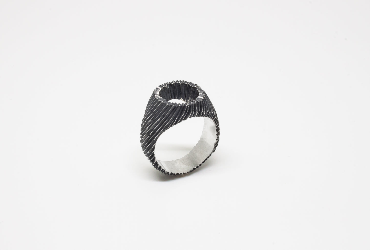 Carved open signet ring in oxidated 925 silver, hand-carved unique piece by Minou Lejeune