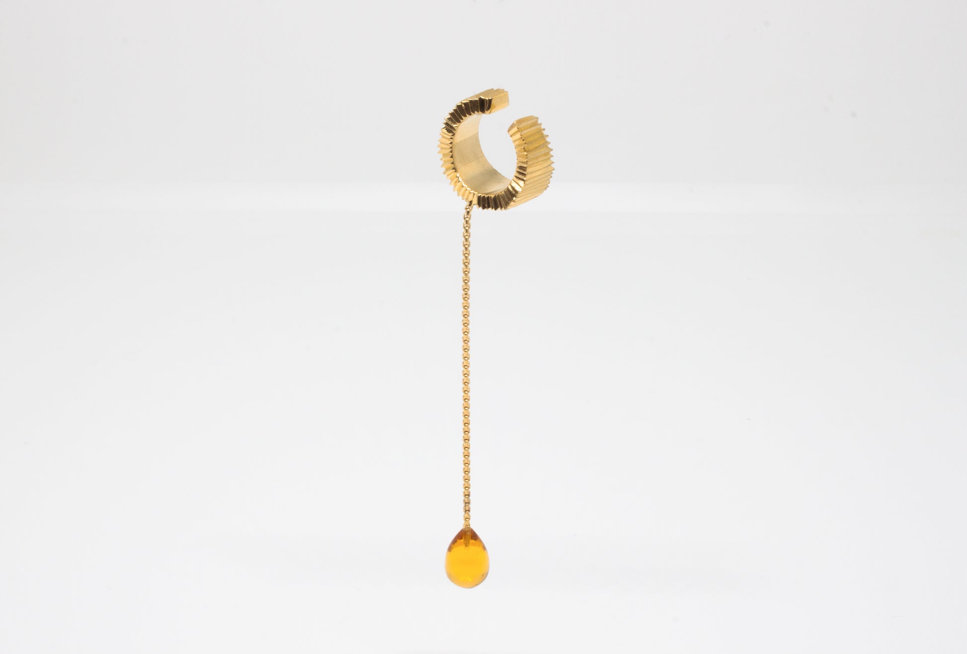 Hand-carved earcuff in goldplated silver with Citrine gemstone, one-of-a-kind piece by Minou Lejeune