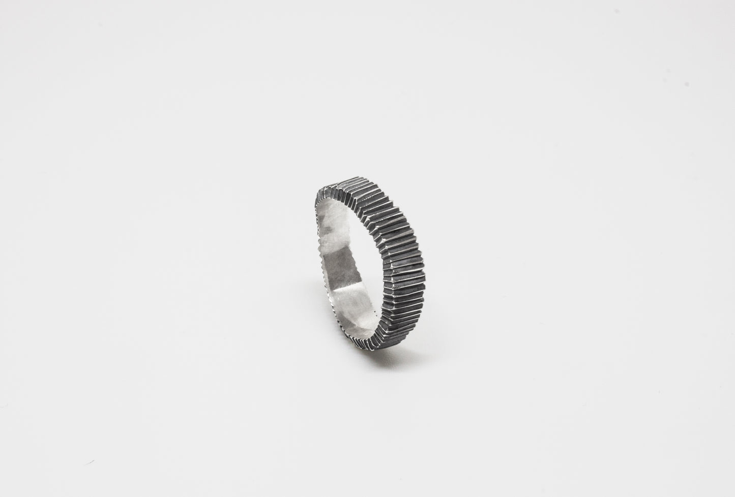 Irregular Carved Ring in 925 oxidated silver, hand-carved and unique piece by Minou Lejeune
