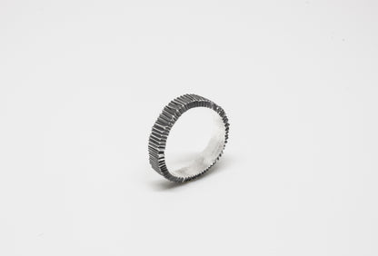 Irregular Carved Ring in 925 oxidated silver, hand-carved and unique piece by Minou Lejeune